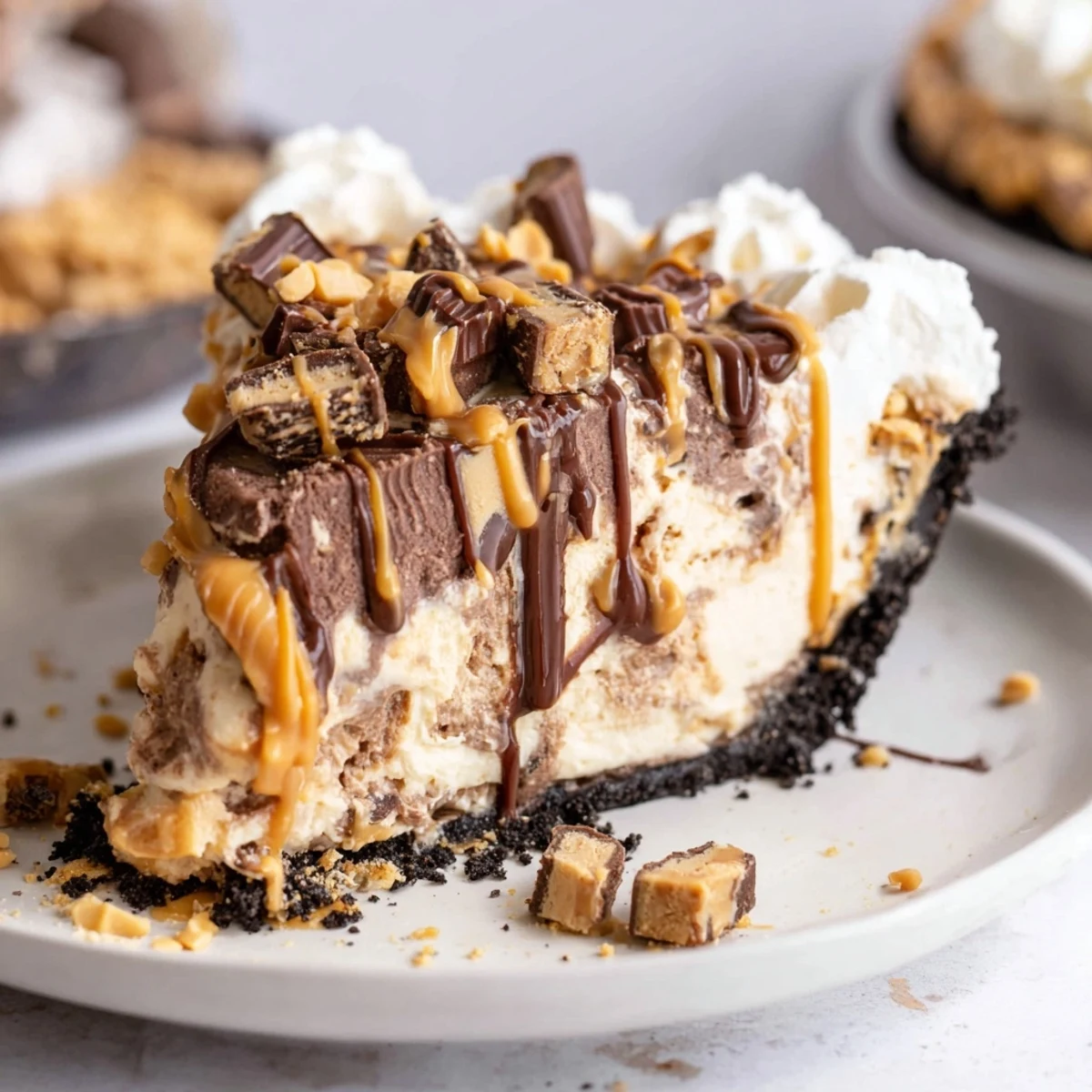 Indulgent Snickers soda float pie with a chocolate crust and whipped cream garnish.