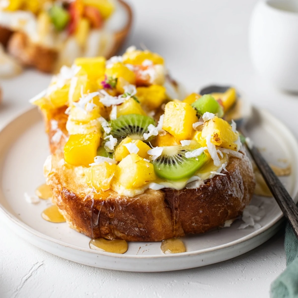 Creamy Yogurt-Custard Toast topped with vibrant mango and kiwi slices.  