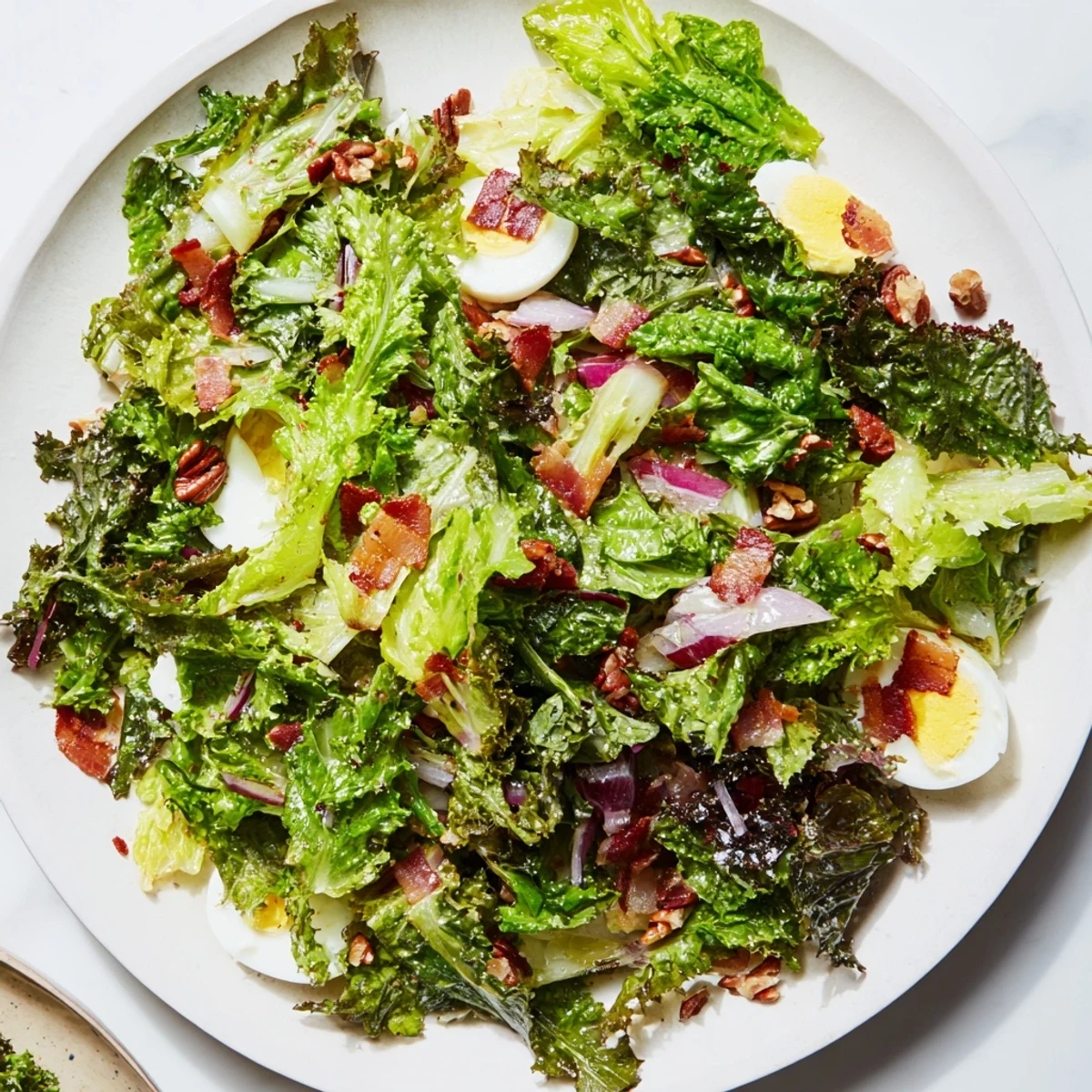 Fresh, vibrant Bitter Greens Salad with Warm Bacon Dressing served warm, perfect for a flavorful light meal.