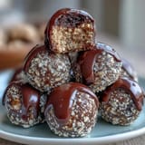 High-protein cookie dough bites with oats, almond butter, and chocolate chips, ready for a healthy snack.