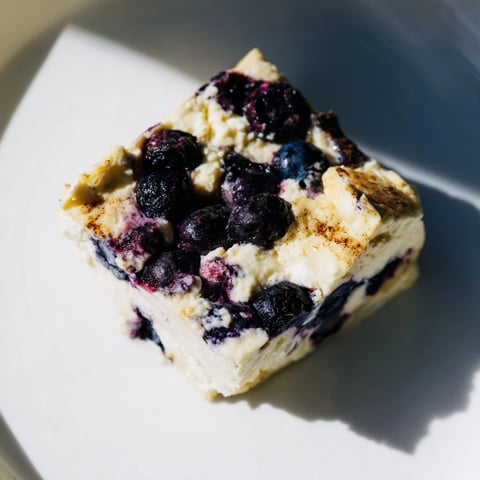 Golden-brown Blueberry Cottage Cheese Bake, baked to perfection with juicy, plump blueberries.