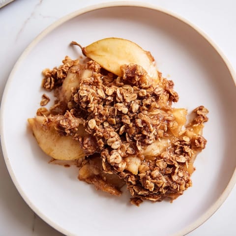 Close-up of the Cinnamon Caramel Pear Crumble, showcasing the buttery oat topping.