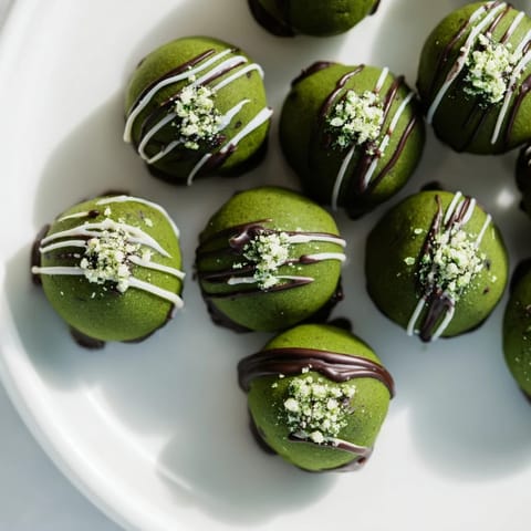 Deep green Matcha Dark Chocolate Peppermint Truffles, a luxurious dessert with a dark chocolate ganache.