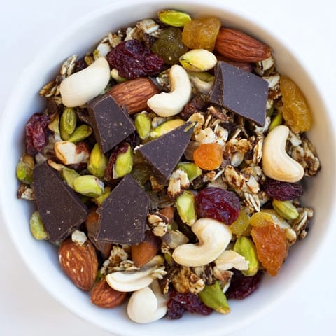 Golden raisins and chocolate chunks are visible in this tasty Mountain High Adventure Snack Mix.