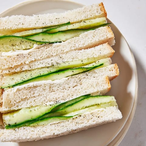 Tiny Castle Feast Royal Tea Party Sandwiches featuring fresh cucumber, smoked salmon, and egg salad fillings.