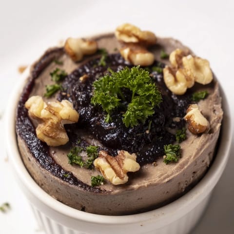 A close-up of The Velvet Underground, showcasing dark pâté, sweet jam swirls, and crunchy nuts.