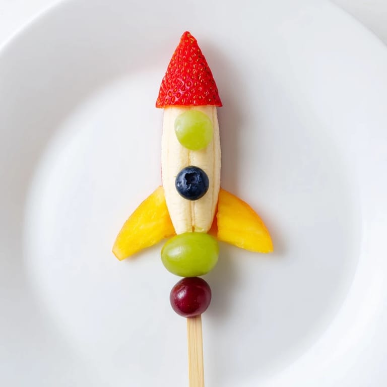 A close-up of delicious Rocket Ship Fruit Skewers ready to be enjoyed as a healthy treat.