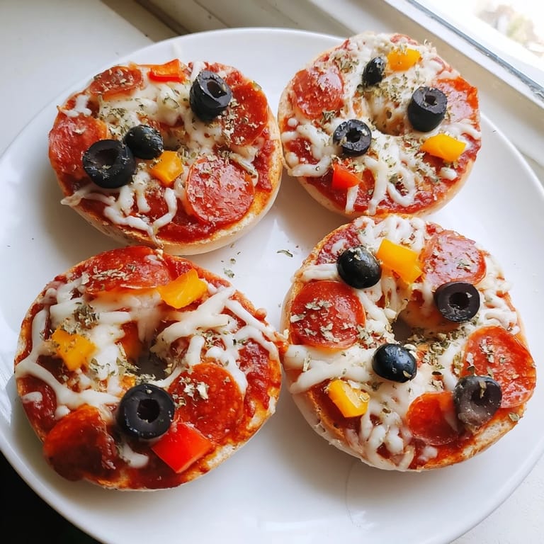 Air-fried mini bagel pizzas—crispy bagels topped with melted cheese, ideal for a game day snack.