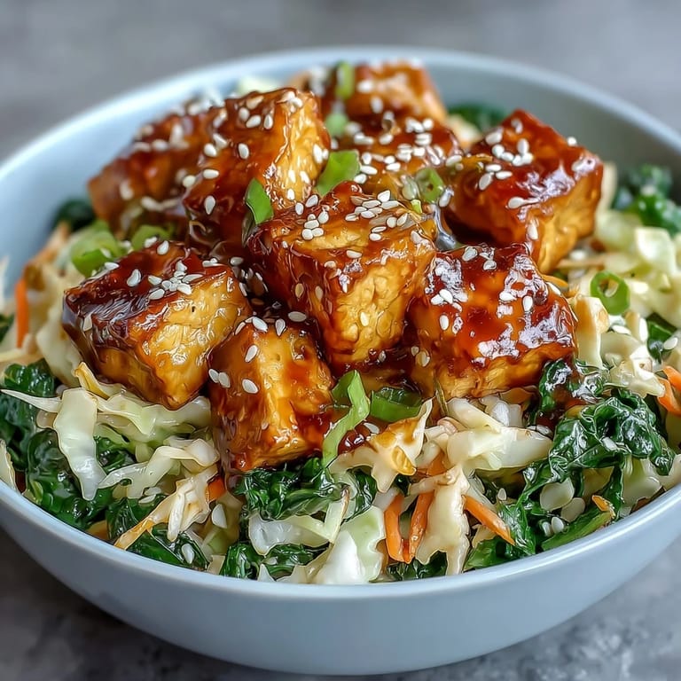 A hearty serving of Tofu Egg Roll in a Bowl topped with sesame seeds and fresh green onions.