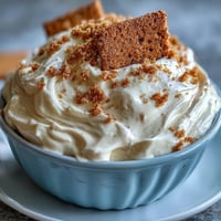 Creamy cheesecake dip with graham crackers, perfect for parties and snacking